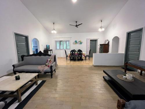 a living room with a couch and a table at Beautiful Villa in Khandala with Hot Tub in Lonavala
