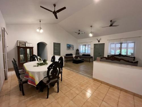 a large living room with a table and chairs at Beautiful Villa in Khandala with Hot Tub in Lonavala