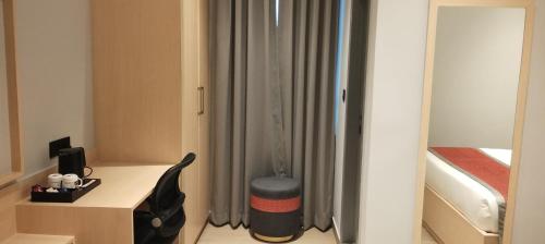 Una cama o camas en una habitación de The Citi Residenci Hotel, Bidhannagar
