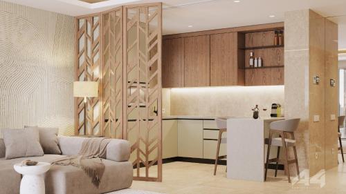 a living room with a couch and a kitchen at Almyros Beach in Acharavi