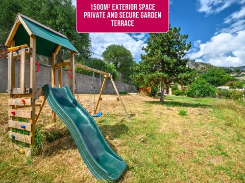 a playground with a slide and a swing set at Villa Horizon - 5min from Monaco - Panoramic view - Infinity Pool - Air conditionner - Garden - Parking - Premium Services - Near Monaco Events in Fontvieille