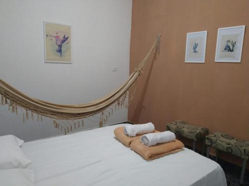 Ένα ή περισσότερα κρεβάτια σε δωμάτιο στο Apartamento Vó Maria
