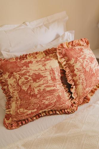 a blanket on top of a bed at Zámecká Stodola - Červený Hrádek u Sedlčan in Sedlčany