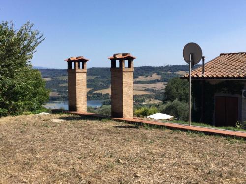 a house with two chimneys on top of a hill at B&B dell'Aviatore in San Liberato