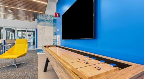 a conference room with a pool table and a yellow chair at Luxury Home W Pool & Gym Mins To Baylor Hospital in Marble Falls