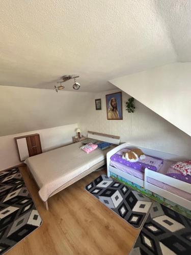 a bedroom with a bunk bed and a bed frame at Ubytovanie u Vlasty in Štrba