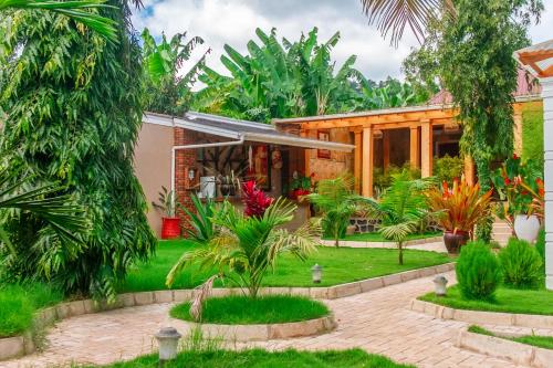 a house with a garden in front of it at Namayani Safari Lodge in Arusha