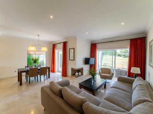 a living room with a couch and a table at Arcos Gardens Sol Rent Golf in Arcos de la Frontera