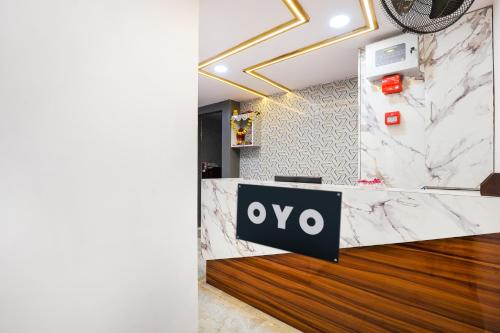 aiya logo on a marble counter in a lobby at Hotel O New A1 in Ahmedabad