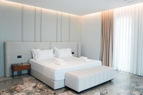 Postel nebo postele na pokoji v ubytování Ilyonis Hotel & Spa