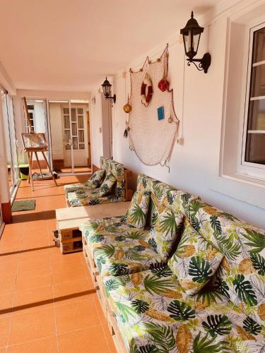 Ένα ή περισσότερα κρεβάτια σε δωμάτιο στο Beachfront Surf & Holiday House, Charming & Quiet