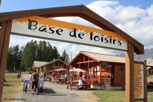 a sign that reads base de iglesias at a market at Logement parents CAMP BASKET SUPERDEVOLUY in Le Dévoluy