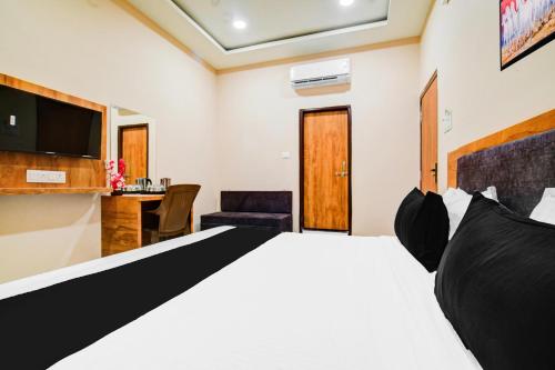 Ένα ή περισσότερα κρεβάτια σε δωμάτιο στο Hotel O Madhuban