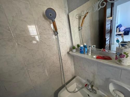 a shower in a bathroom with a toilet and a mirror at North coast Great nightlife shoreside Marina AlAlamain مارينا الساحل الشمالي in El Alamein