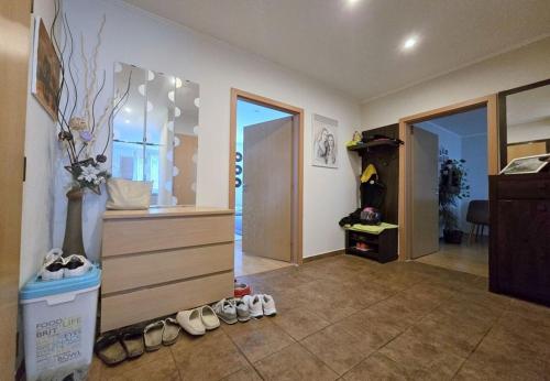 a room with a bunch of shoes on the floor at Apartmán MARKI in Malacky