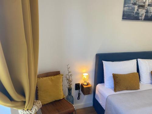 a bedroom with a bed and a table with a lamp at Dalmatia Nin apartment in Nin