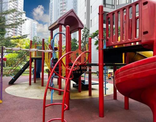 a park with a playground with a slide at Large & Strategic 3BR Taman Rasuna Apt Pool in Jakarta