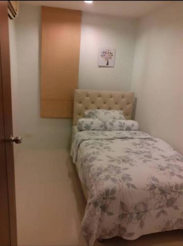 a small bedroom with a bed in a room at Phuket, The Pixcel Cape Panwa Condo in Ban Ao Makham