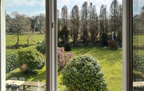 a window with a view of a garden at 3 Bedroom Gorgeous Home In Plouaret in Plouaret