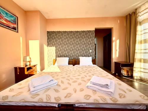 Postel nebo postele na pokoji v ubytování Family Hotel Carpe Diem
