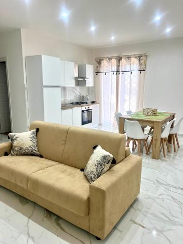 a living room with a couch and a table at Dodi's house in Pozzuoli
