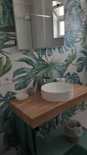 a bathroom with a sink and a mirror at Appartamento Stella Marina in Gabicce Mare