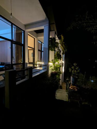 a house at night with lights on the side of it at Su Casa Ella in Ella