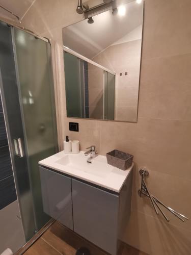 a bathroom with a sink and a mirror at La Casa di Marta in Ateleta