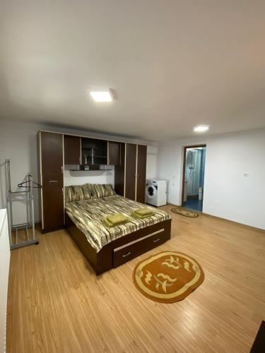 a bedroom with a large bed and a wooden floor at Casa Rizea 