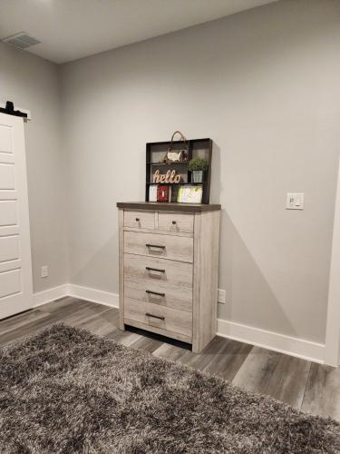 a bedroom with a dresser in a room at Modern Retreat in Sherman in Sherman