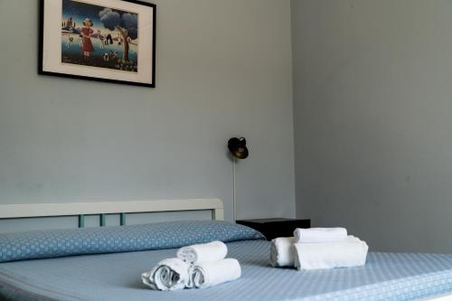 a bedroom with two beds with towels on them at Palia's Hotel in Laino Borgo