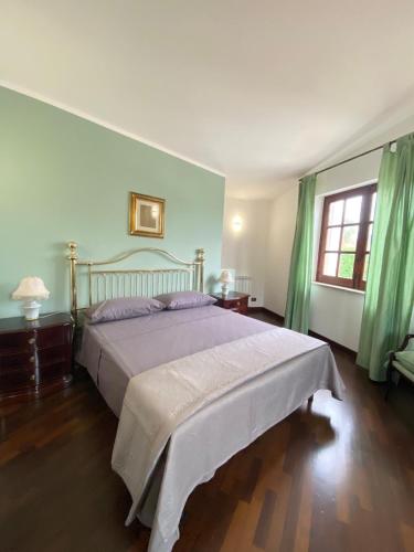 Ένα ή περισσότερα κρεβάτια σε δωμάτιο στο Casa Mini'