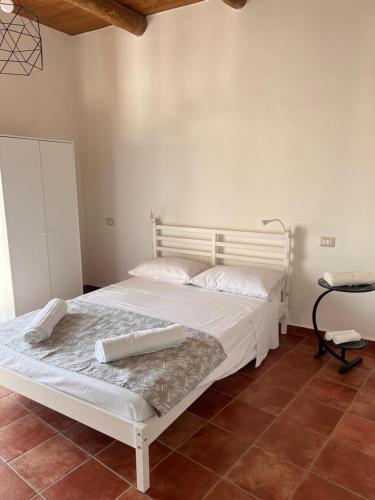 Una cama o camas en una habitación de Affittacamere Bio