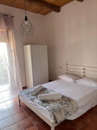 Una cama o camas en una habitación de Affittacamere Bio