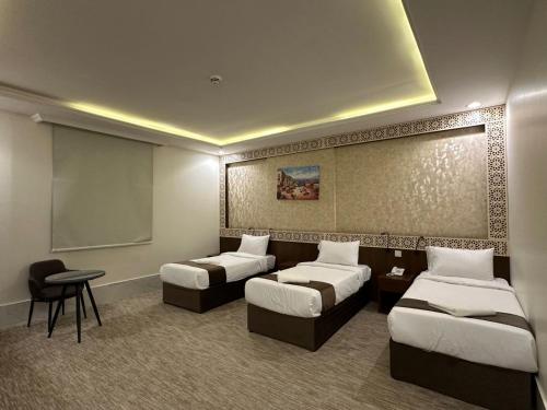 Un ou plusieurs lits dans un hébergement de l'établissement فندق برايت