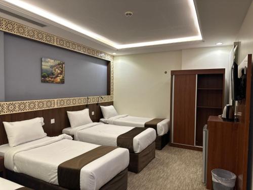 Un ou plusieurs lits dans un hébergement de l'établissement فندق برايت