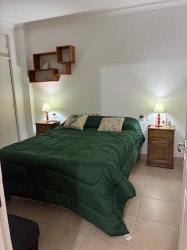 En eller flere senge i et værelse på Departamento centrico