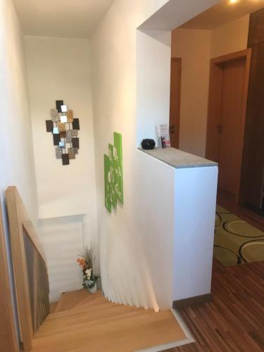 a room with a white wall with a counter at Hotel Erlebniswelt Stocker in Schladming