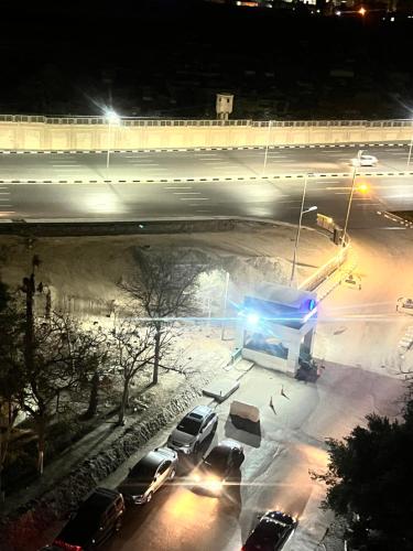 a snow covered parking lot at night with cars parked at Aqua Degla Luxury Villa 199 street Maadi Degla in Cairo