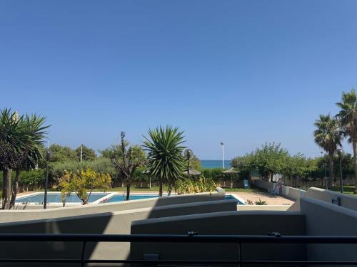 Swimmingpoolen hos eller tæt på Relax frente al mar - Tu bajo con vistas