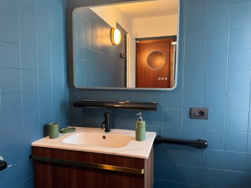 a bathroom with a sink and a mirror at Flat in Duomo in Milan