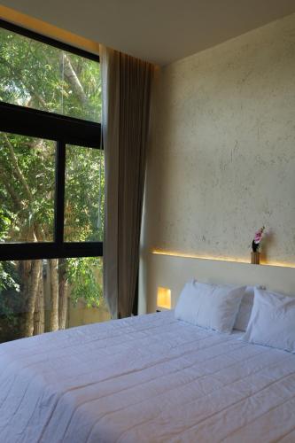 Postel nebo postele na pokoji v ubytování Casa Oneiro Hotel Boutique & Suites
