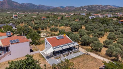 an aerial view of a house with a red roof at Hideaway Thassos in Limenaria