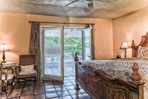 a bedroom with a bed and a patio at La Maison Hotel - Adults Only in Palm Springs
