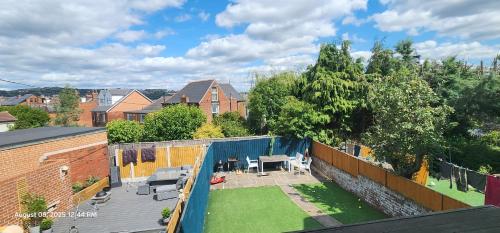 an aerial view of a backyard with a patio at Lovely Commodious, Private Charming Studio, En Suite in Hillsborough