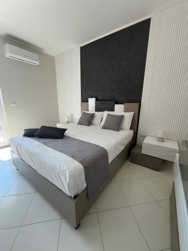 Ένα ή περισσότερα κρεβάτια σε δωμάτιο στο Bea's Home - Pompei - Scafati