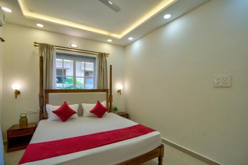 Ένα ή περισσότερα κρεβάτια σε δωμάτιο στο Tranquil 3bhk Pvt Pool Villa