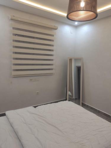 Ένα ή περισσότερα κρεβάτια σε δωμάτιο στο Appartement calme