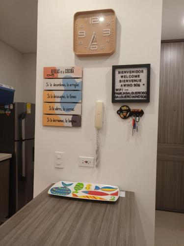 a surfboard on a counter with a phone on a wall at APARTAMENTO VISTA AL MAR WIND 906 in Gaira