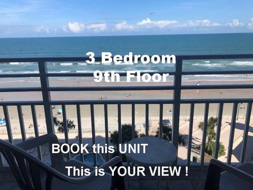 a balcony with a view of the beach and the ocean at Ocean Walk Resort - Dramatic 3 BR Ocean Front View in Daytona Beach